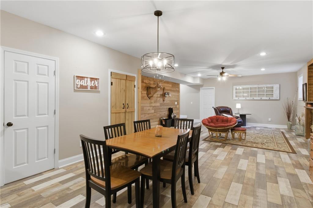 37 Farmstead Way Senoia, GA 30276 - Photo 91 of 121 a view of a dining room with furniture and wooden floor