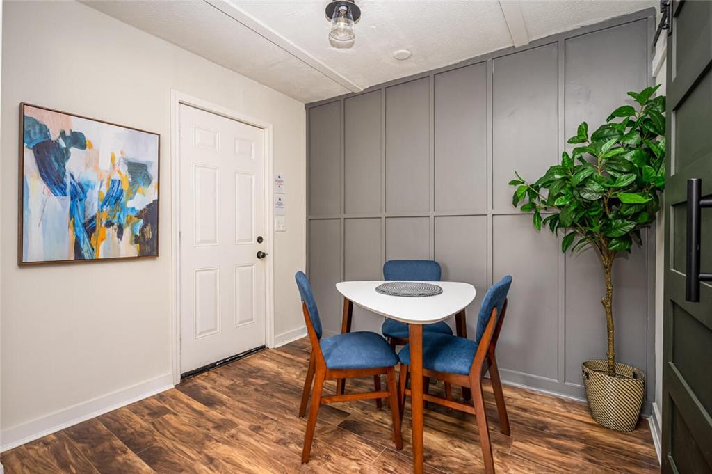 3154 Oakcliff Road Northwest Atlanta, GA 30311 - Photo 12 of 41 a view of a room with furniture and wooden floor