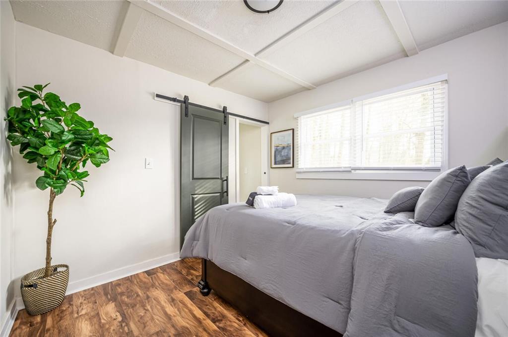 3154 Oakcliff Road Northwest Atlanta, GA 30311 - Photo 15 of 41 a bedroom with a bed and a plant