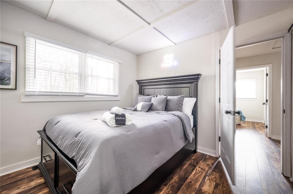 3154 Oakcliff Road Northwest Atlanta, GA 30311 - Photo 16 of 41 a bedroom with a bed and wooden floor