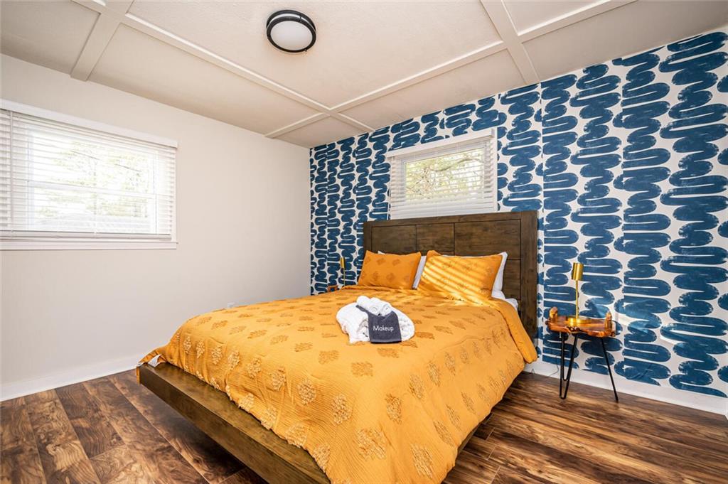 3154 Oakcliff Road Northwest Atlanta, GA 30311 - Photo 26 of 41 a bedroom with a bed and wooden floor