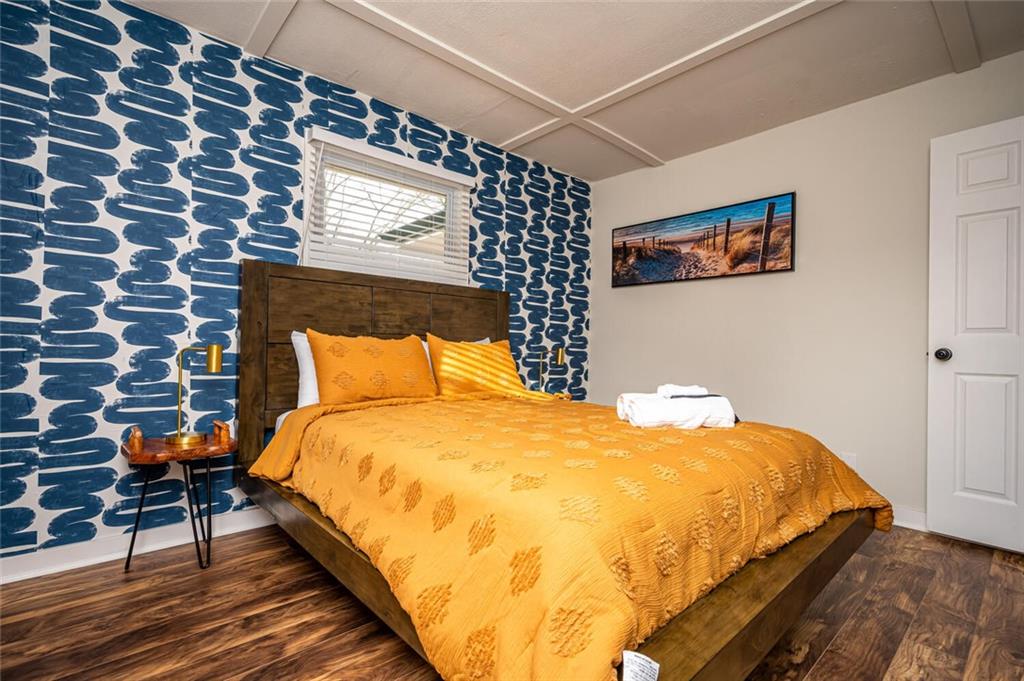 3154 Oakcliff Road Northwest Atlanta, GA 30311 - Photo 28 of 41 a bed sitting in a bedroom next to a small yard