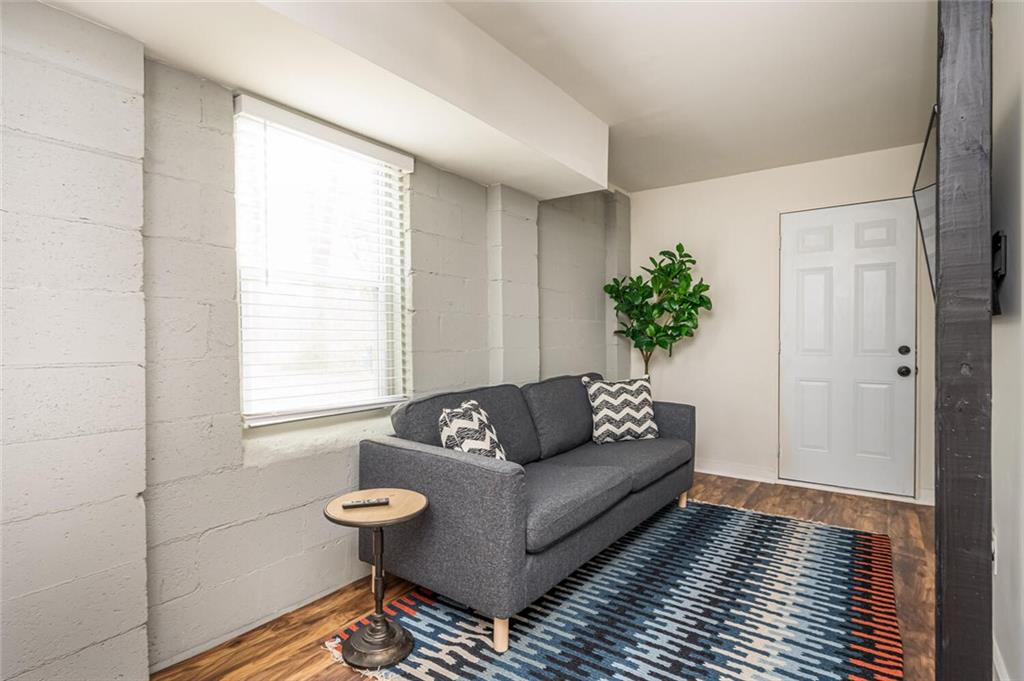 3154 Oakcliff Road Northwest Atlanta, GA 30311 - Photo 30 of 41 a living room with furniture and a potted plant
