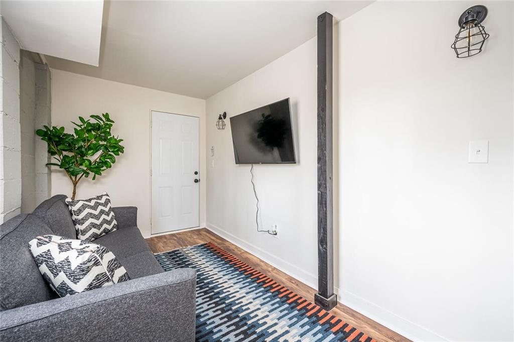 3154 Oakcliff Road Northwest Atlanta, GA 30311 - Photo 31 of 41 a living room with furniture and a flat screen tv