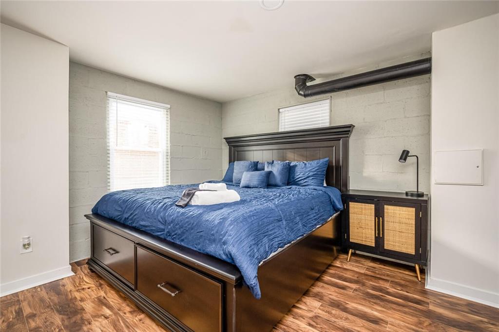 3154 Oakcliff Road Northwest Atlanta, GA 30311 - Photo 33 of 41 a bed sitting in a bedroom next to a window