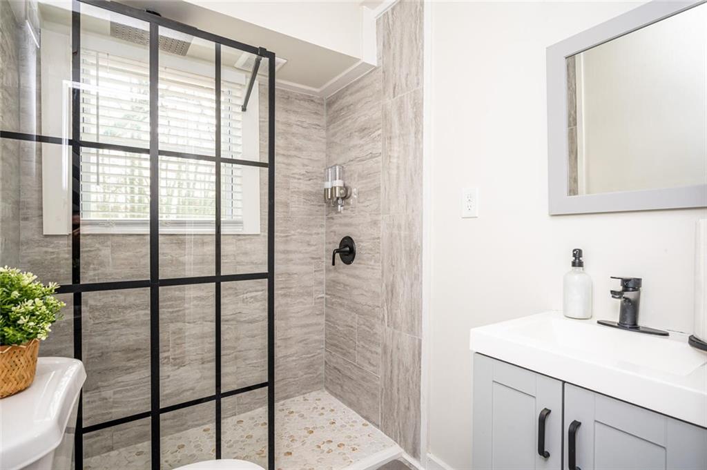 3154 Oakcliff Road Northwest Atlanta, GA 30311 - Photo 35 of 41 a bathroom with a shower and a sink