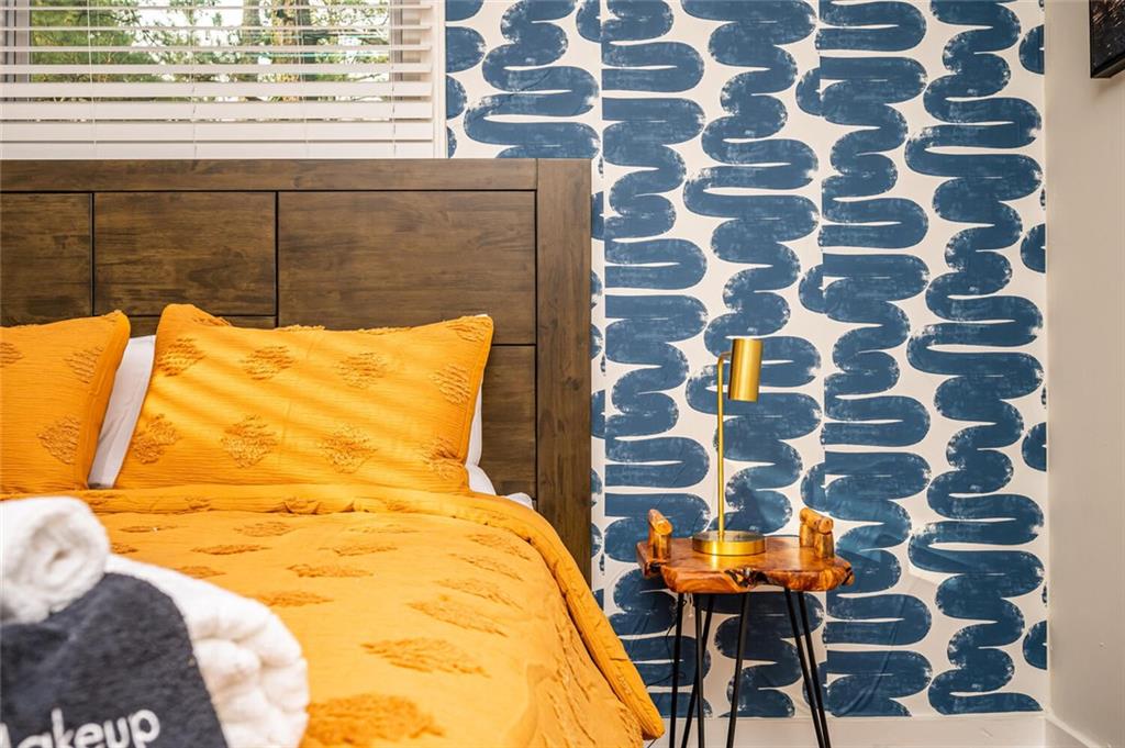 3154 Oakcliff Road Northwest Atlanta, GA 30311 - Photo 4 of 41 a bed sitting in a bedroom next to a window