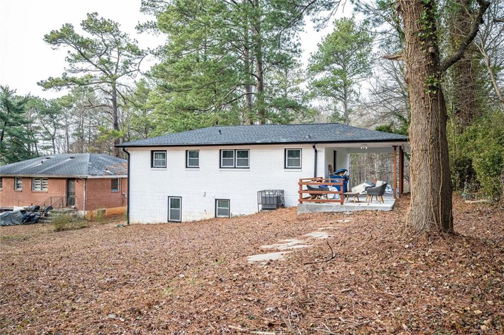 3154 Oakcliff Road Northwest Atlanta, GA 30311 - Photo 41 of 41 a view of a house with backyard and sitting area