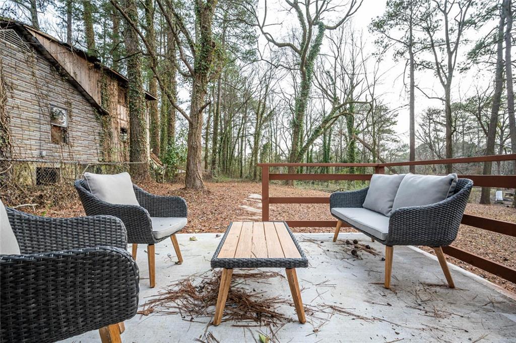 3154 Oakcliff Road Northwest Atlanta, GA 30311 - Photo 5 of 41 a view of backyard with seating space and trees