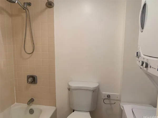 a bathroom with a shower and toilet