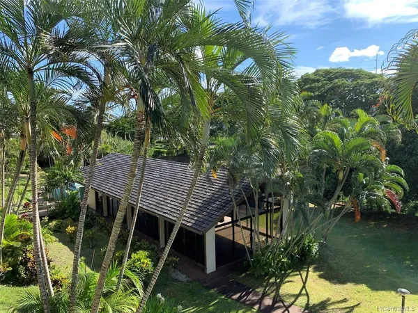 a view of backyard with seating space