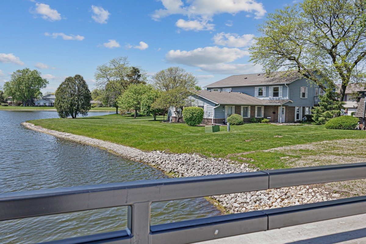 784 Leicester Road Elk Grove Village, IL 60007 - Photo 2 of 27 a view of a big house with a big yard and large trees