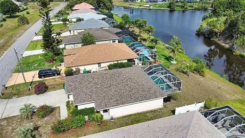 an aerial view of a house with a garden and plants