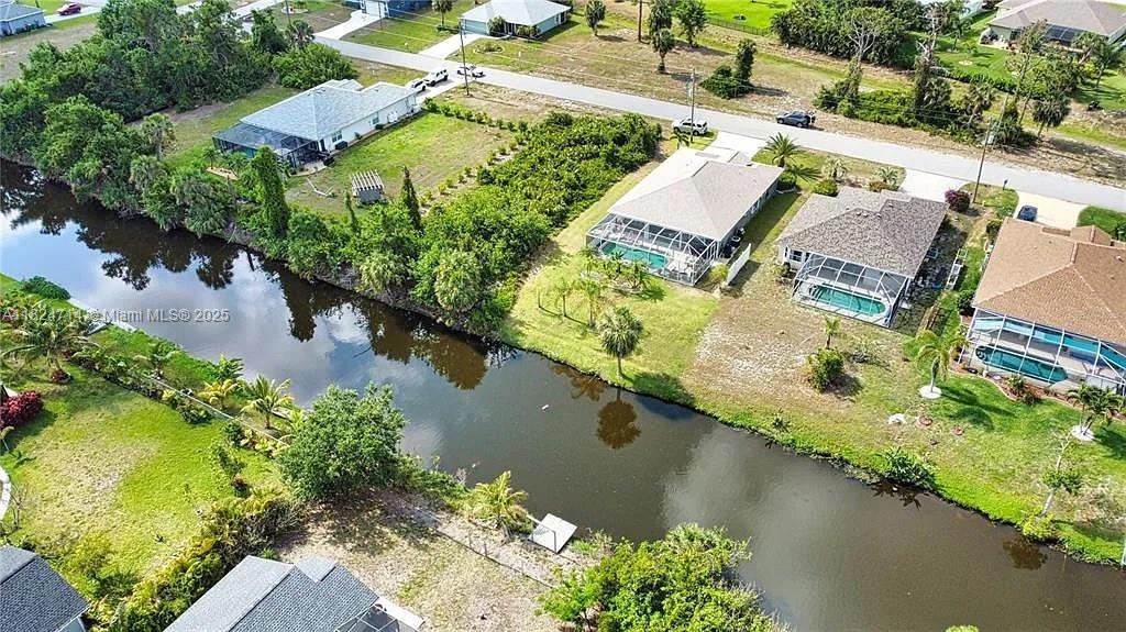 150 Albatross Road Rotonda West, FL 33947 - Photo 6 of 7 an aerial view of a house with a lake view