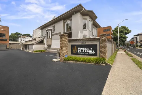 a view of a house with a street