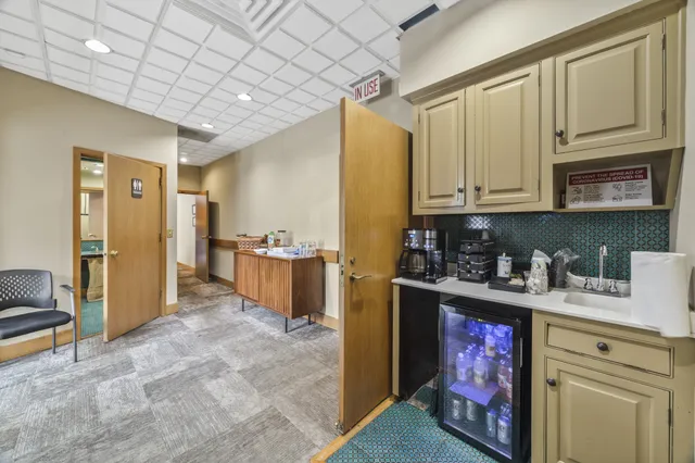 a view of a chairs and table in the balcony