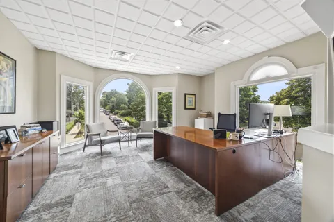 a view of a street with a building in the background