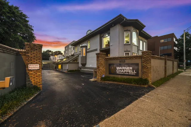 a backyard of a house with outdoor seating