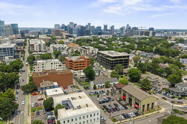 a kitchen with a sink appliances and cabinets