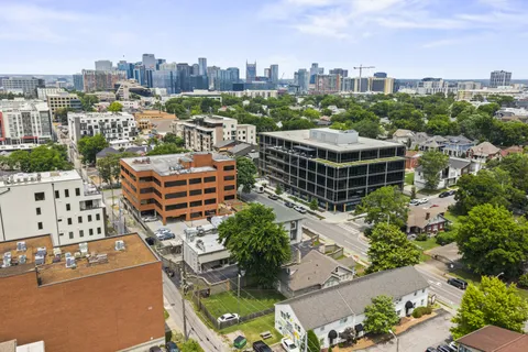 a kitchen with granite countertop a stove sink and cabinets