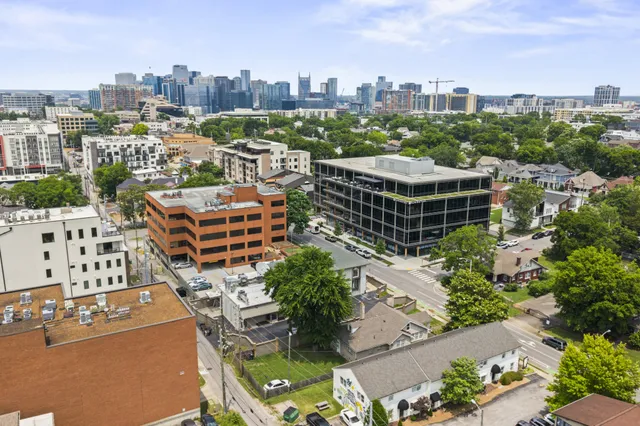 a kitchen with granite countertop a stove sink and cabinets