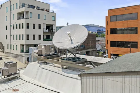 a kitchen with a refrigerator and a counter top space