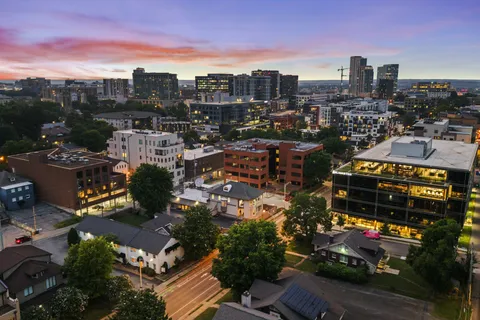 a kitchen with stainless steel appliances a stove a sink and a refrigerator