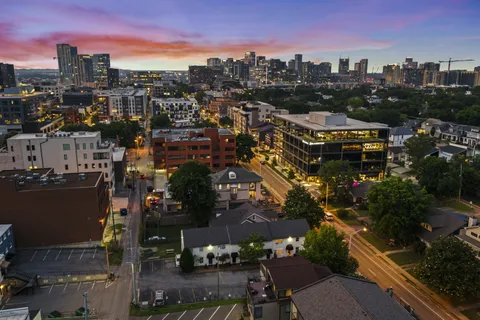 a view of a livingroom with furniture and staircase