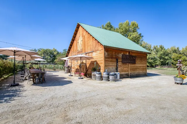a backyard of a house with lots of green space