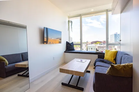a living room with furniture and a window