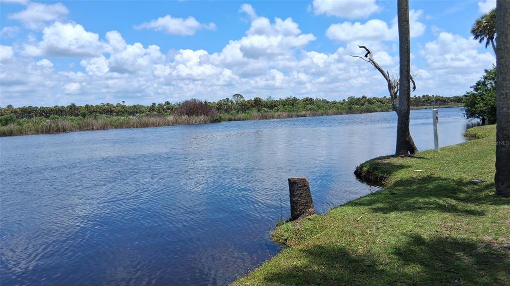 1300 State Rte 777, Unit W 86 Venice, FL 34293 - Photo 5 of 15 a view of a lake from a yard