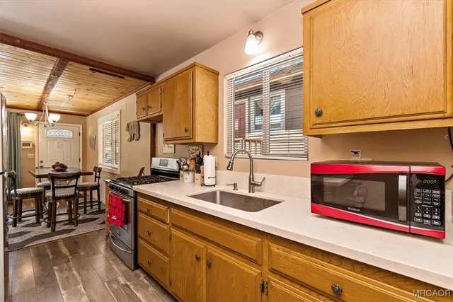 a kitchen with sink and cabinets