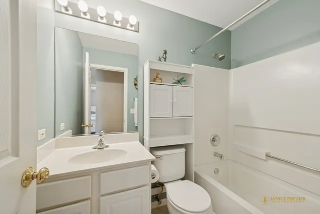 a bathroom with a sink toilet tub and shower