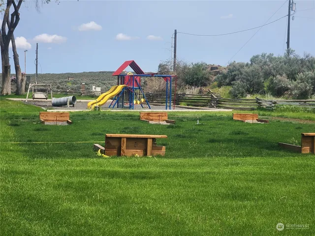 a view of a wooden deck and a yard