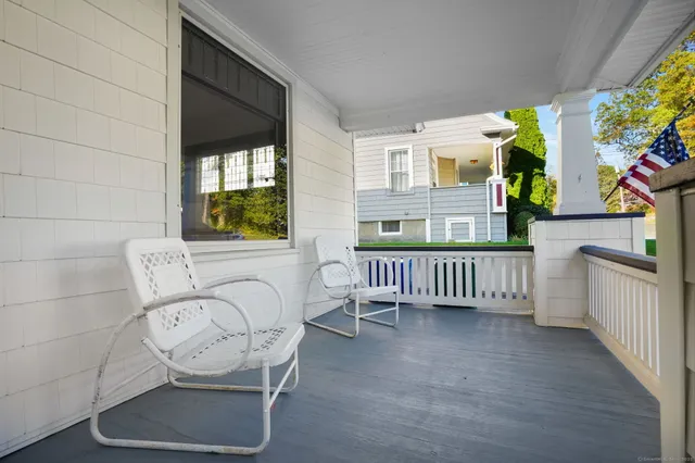 a view of porch with a bench