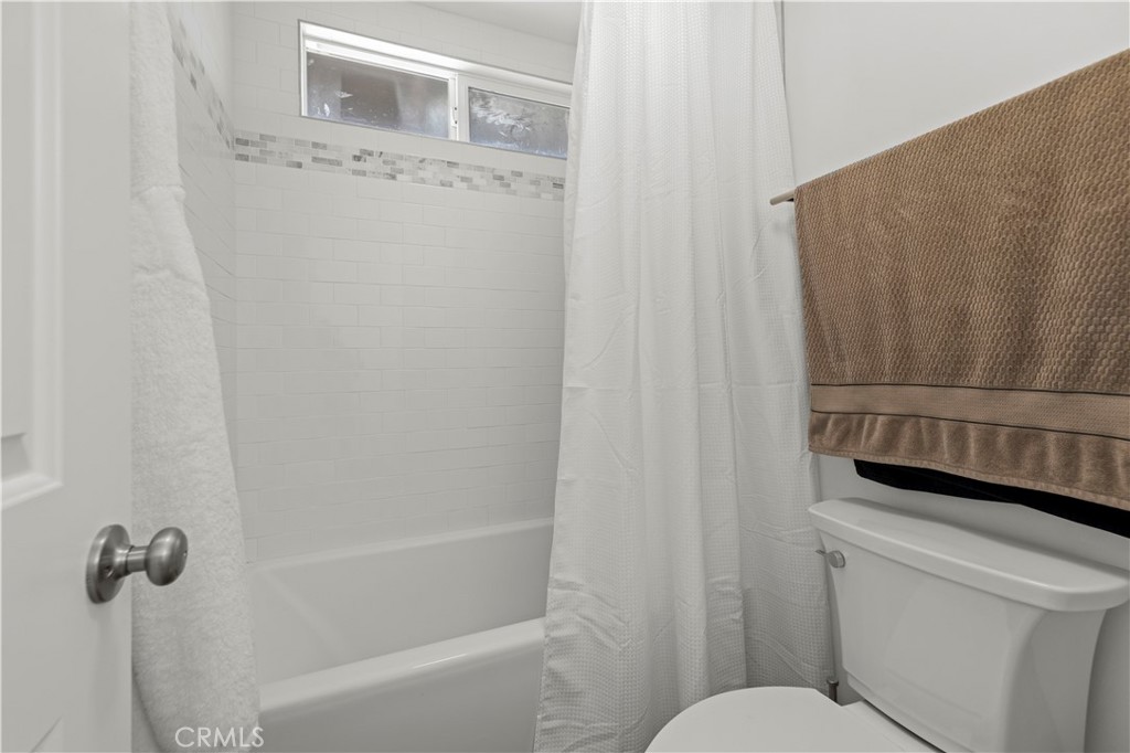 3855 Acton Avenue Acton, CA 93510 - Photo 10 of 21 a bathroom with a granite countertop sink toilet and shower