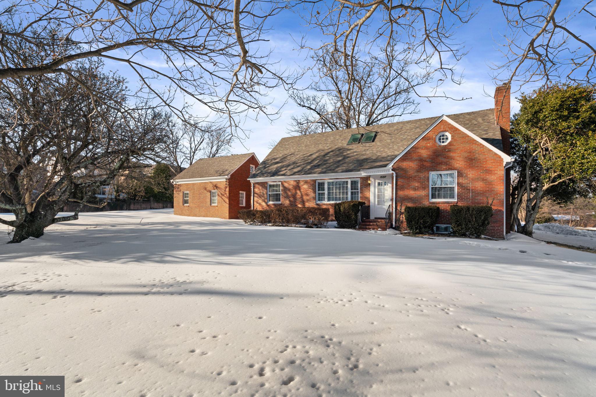 1688 Chain Bridge Road McLean, VA 22101 - Photo 2 of 4 a front view of house with yard