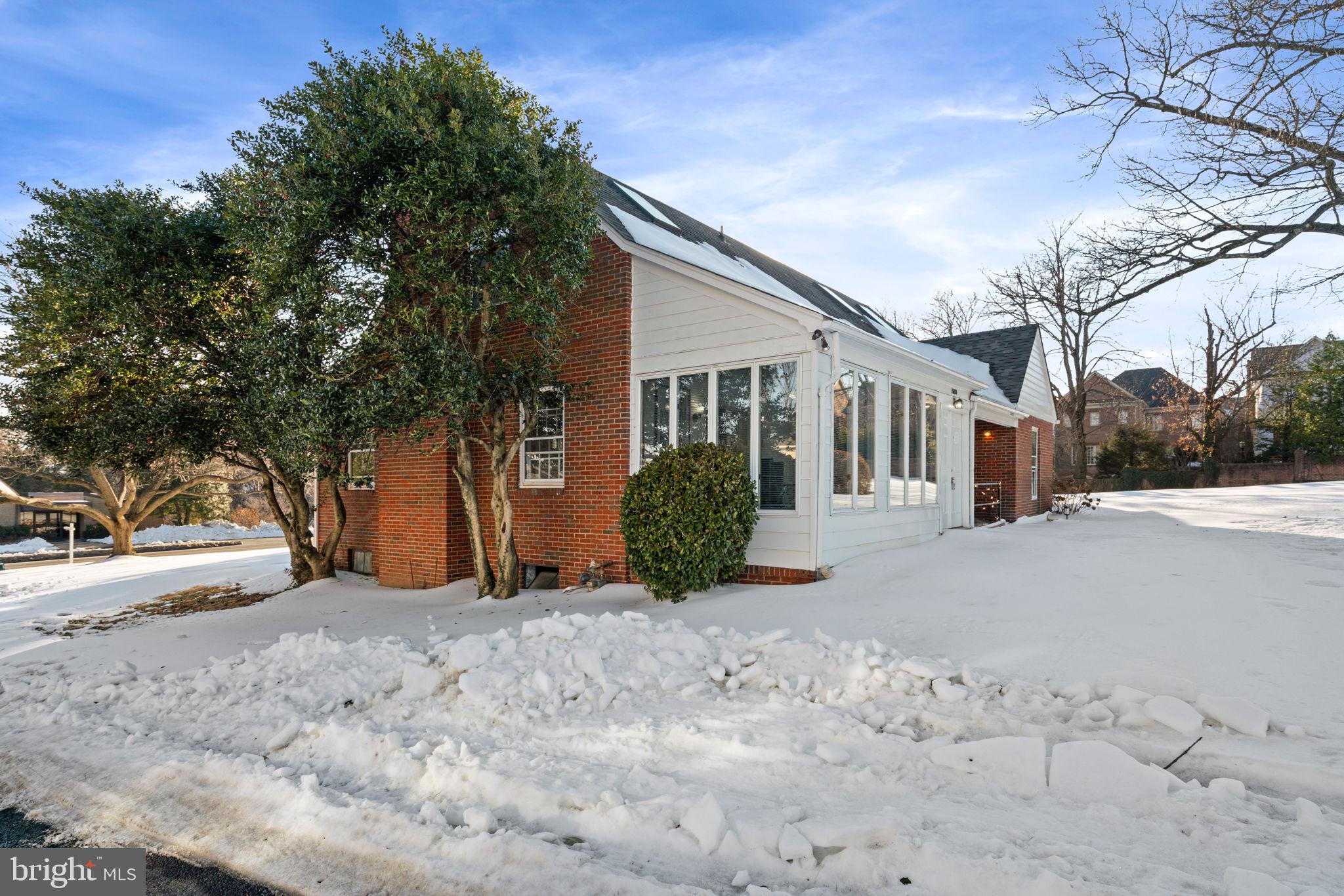 1688 Chain Bridge Road McLean, VA 22101 - Photo 3 of 4 a view of a house with a snow in the yard