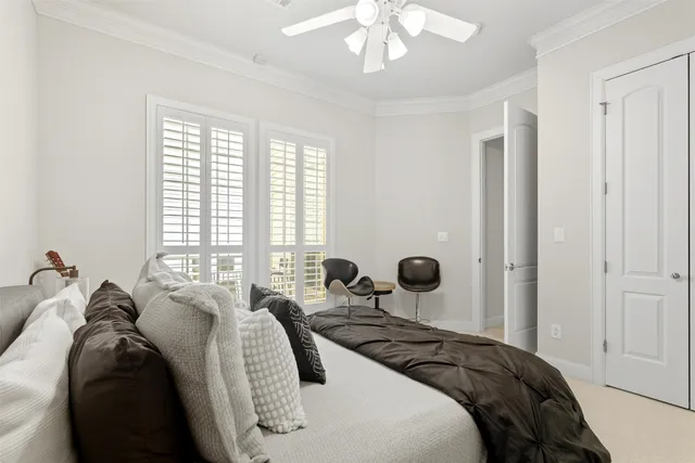 a bedroom with bed and a window