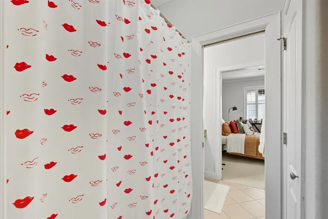 a room that has a lot of flower and a white walls