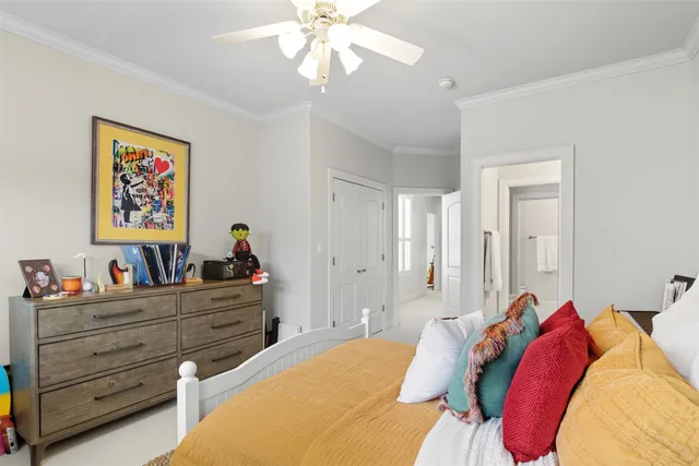 a bed room with a bed and a chandelier