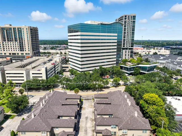 a view of a patio with table and chairs and potted plants