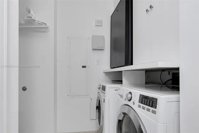 a utility room with dryer and washer