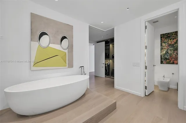 a bathroom with a bathtub and a toilet
