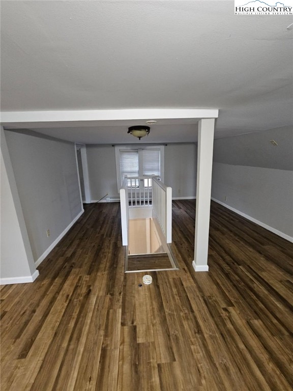 10884 Highway 105 Banner Elk, NC 28604 - Photo 8 of 11 a hallway view with wooden floor and staircase