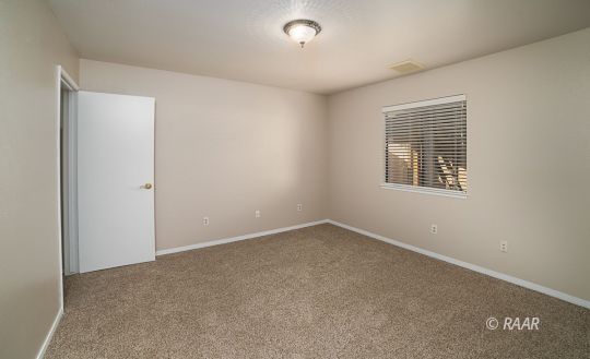 1104 Argus Street Ridgecrest, CA 93555 - Photo 9 of 25 an empty room with a window