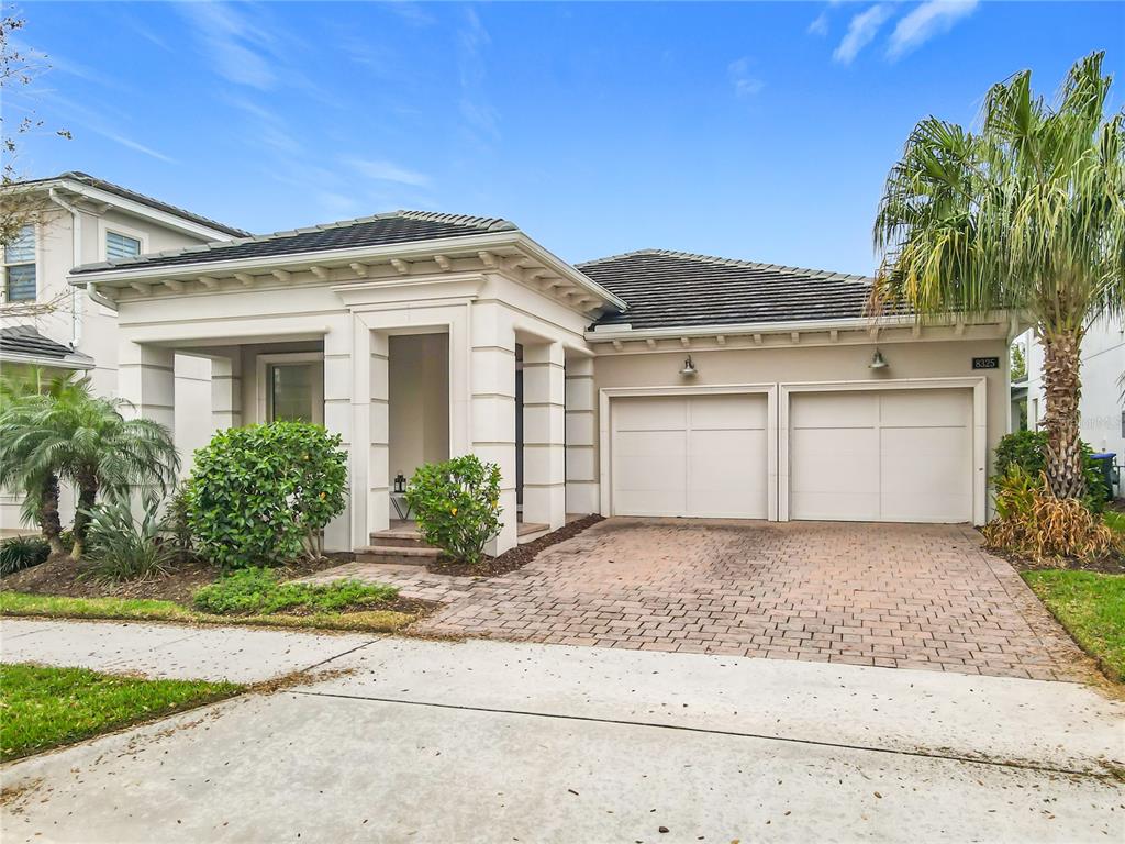 8325 Topsail Place Winter Garden, FL 34787 - Photo 1 of 74 a front view of a house with a garden