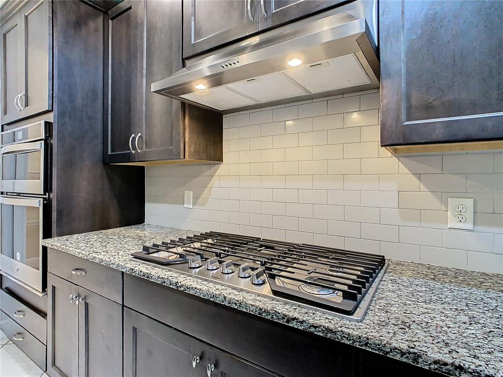 8325 Topsail Place Winter Garden, FL 34787 - Photo 17 of 74 a stove top oven sitting inside of a kitchen