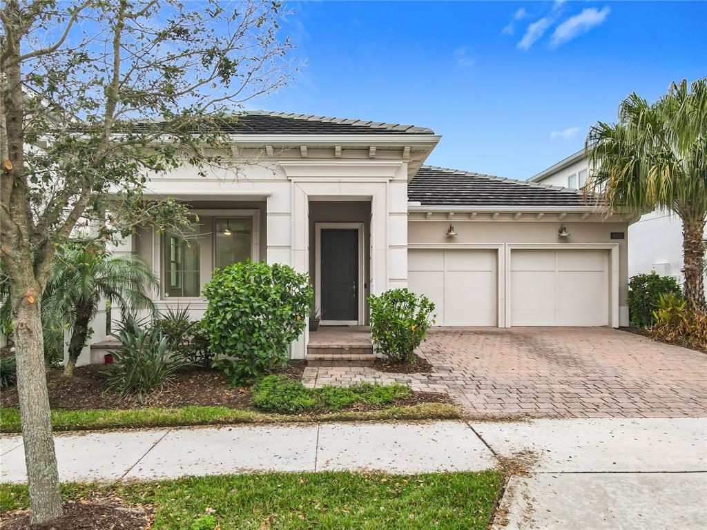 8325 Topsail Place Winter Garden, FL 34787 - Photo 2 of 74 a front view of a house with garden