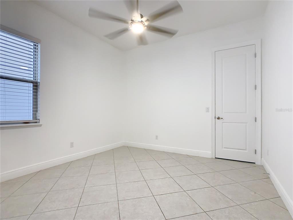 8325 Topsail Place Winter Garden, FL 34787 - Photo 38 of 74 an empty room with closet and windows